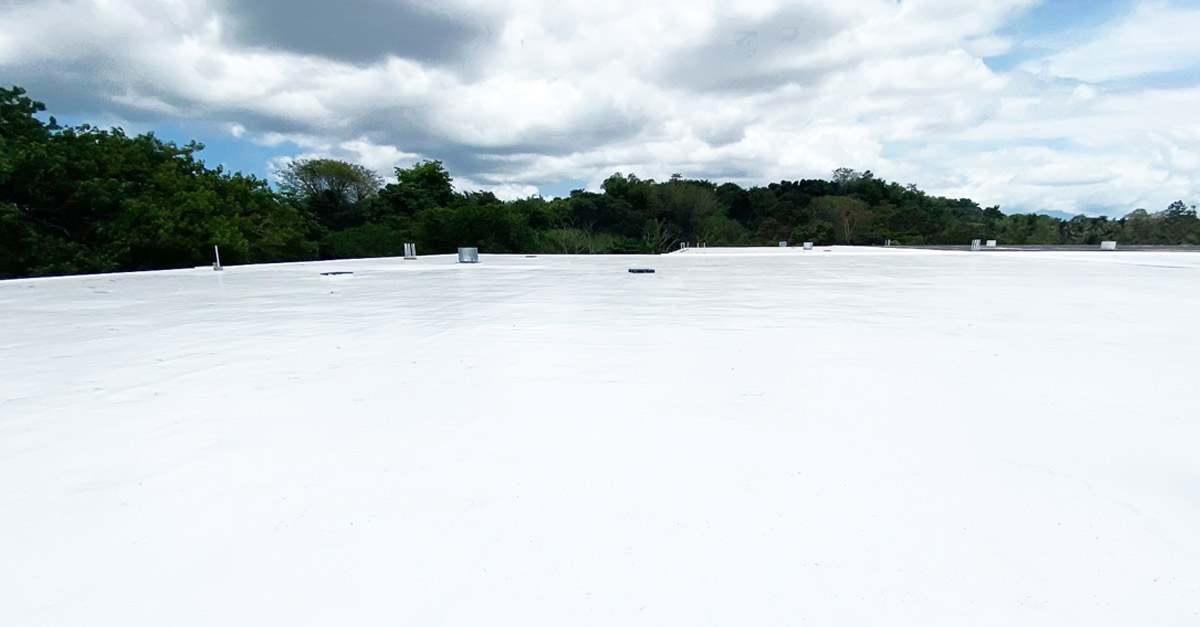 Picturing showing a warehouse roof after the application of PolyBrite Silicone Roof Coatings